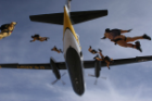 U.S. Army Parachute Team Golden Knights jumping out of a plane